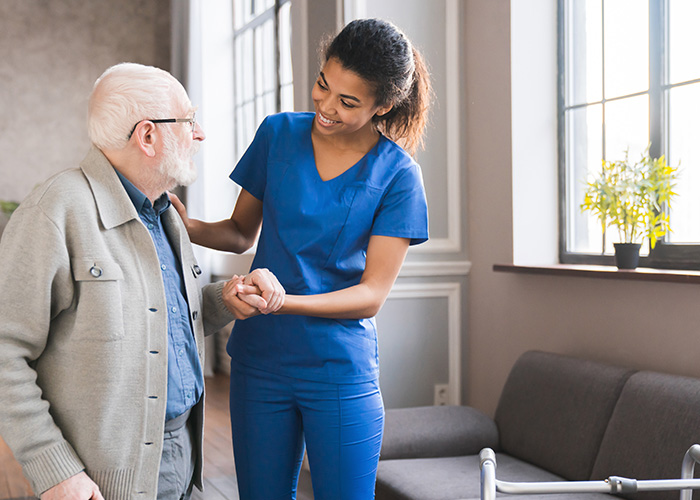 image of staff helping senior man